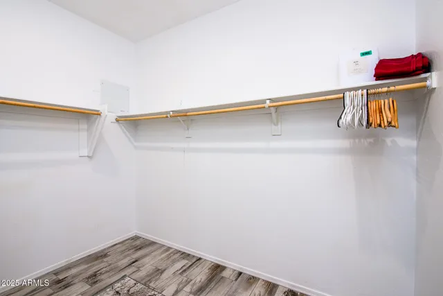 a large bathroom with a sink a mirror and a shower