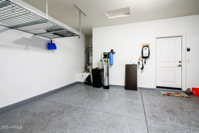 a view of a lake with boats and trees in the background