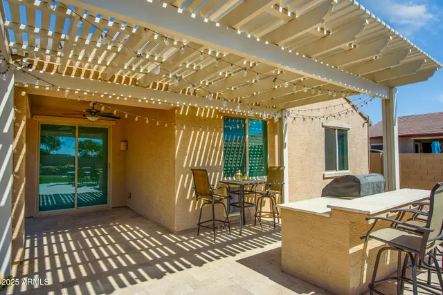 a view of a house with backyard porch and patio