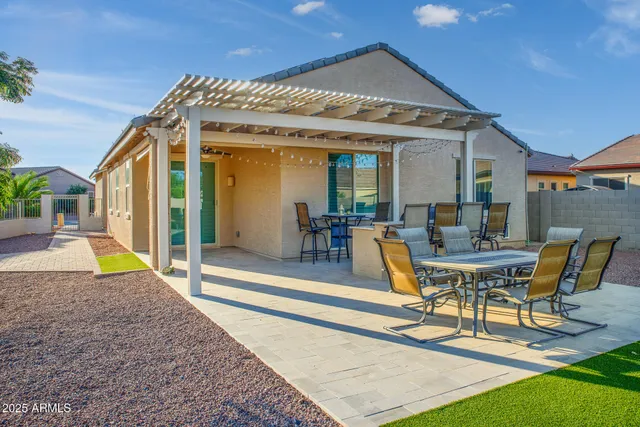 an aerial view of a house with a garden and patio