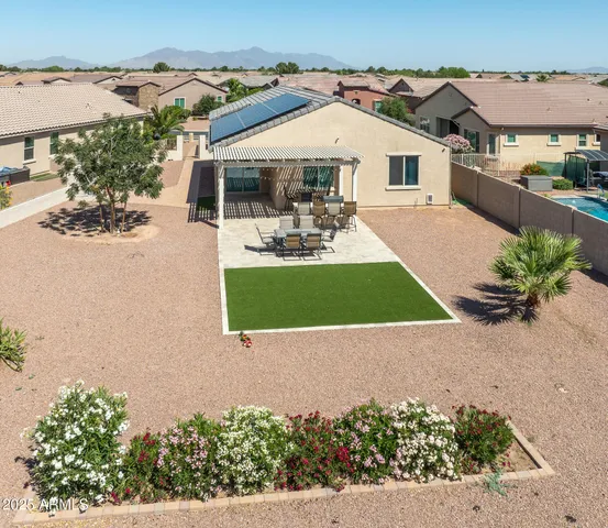 an ocean view with residential house and car parked on street side