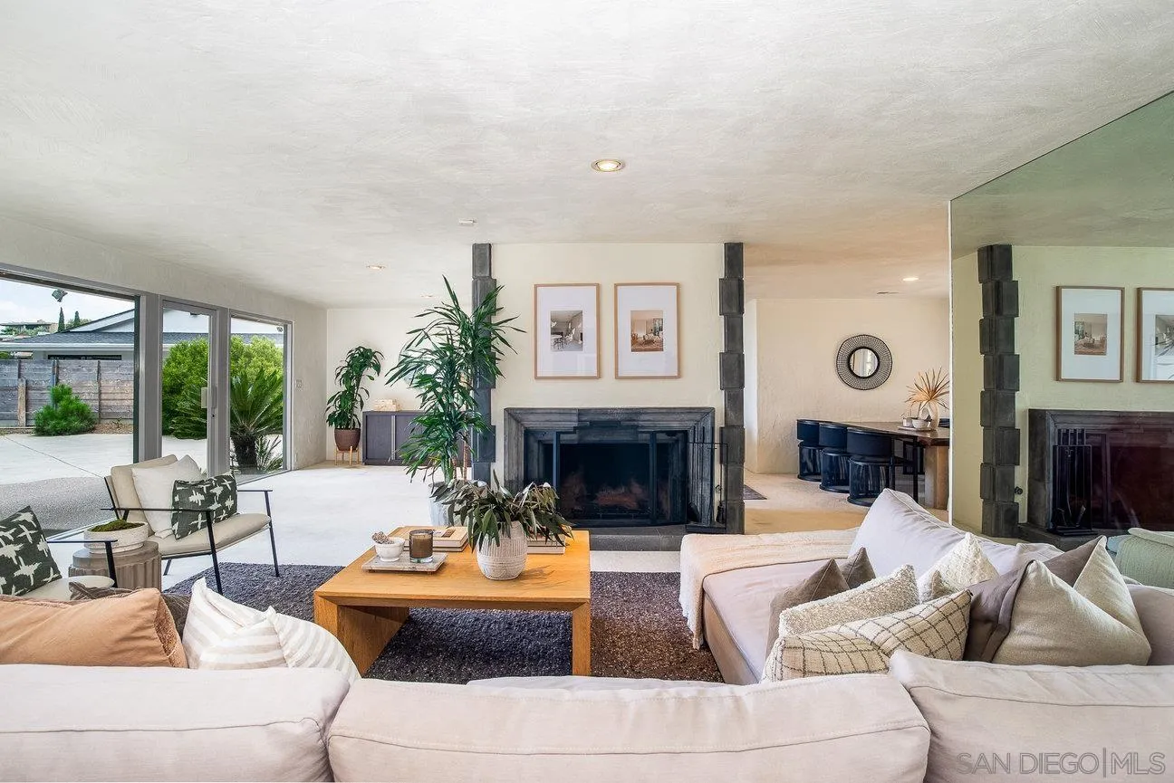 2349 Rue Adriane La Jolla, CA 92037 - Photo 16 of 36 a living room with furniture and a fireplace