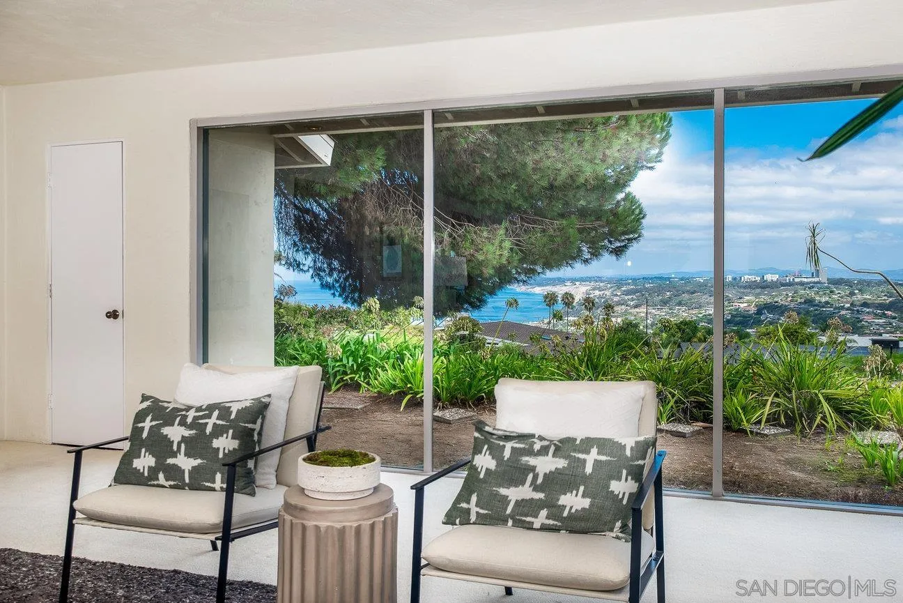 2349 Rue Adriane La Jolla, CA 92037 - Photo 17 of 36 a view of a patio with couches chairs and a potted plant