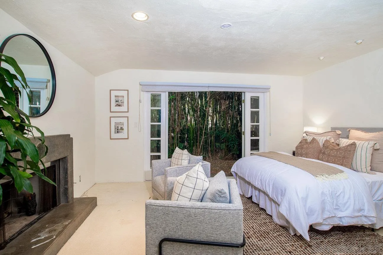 2349 Rue Adriane La Jolla, CA 92037 - Photo 19 of 36 a bedroom with bed and a couch