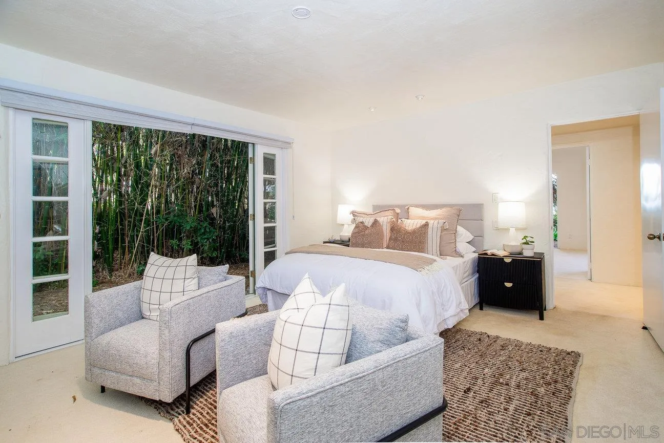 2349 Rue Adriane La Jolla, CA 92037 - Photo 20 of 36 a bedroom with a bed and a couch