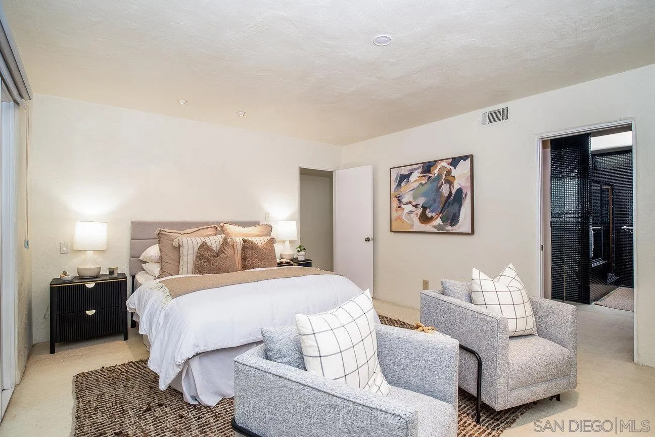 2349 Rue Adriane La Jolla, CA 92037 - Photo 21 of 36 a bedroom with a bed and couch