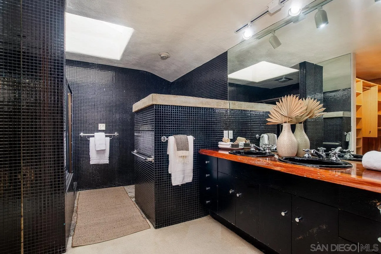 2349 Rue Adriane La Jolla, CA 92037 - Photo 22 of 36 a kitchen area with stainless steel appliances a sink dishwasher and cabinets