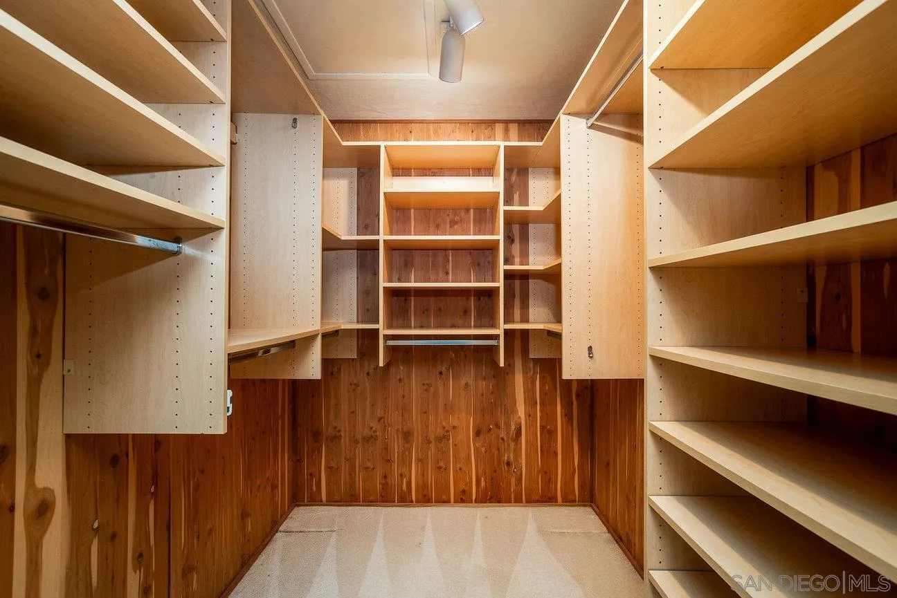 2349 Rue Adriane La Jolla, CA 92037 - Photo 24 of 36 a view of walk in closet with empty racks