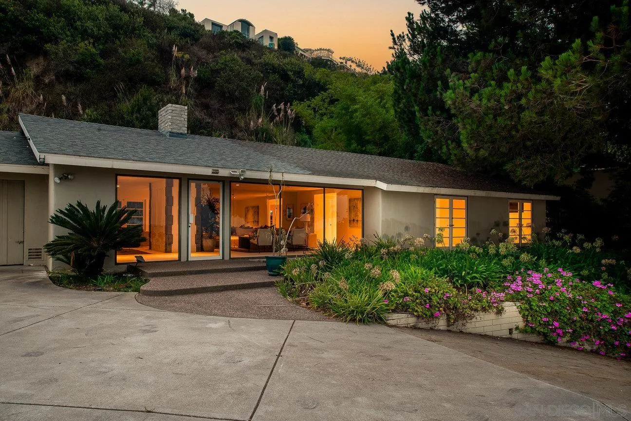 2349 Rue Adriane La Jolla, CA 92037 - Photo 3 of 36 a view of a backyard with potted plants and large tree
