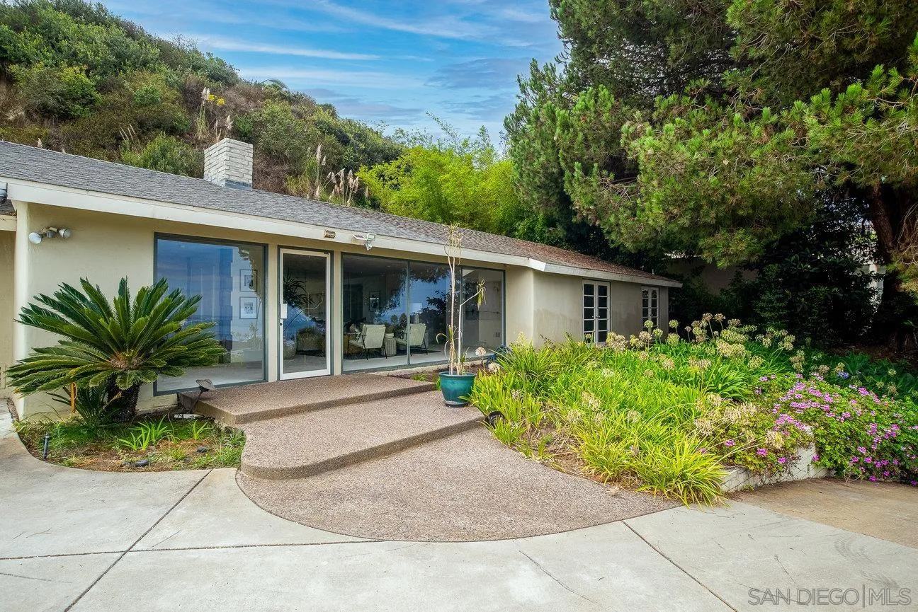 2349 Rue Adriane La Jolla, CA 92037 - Photo 32 of 36 a front view of a house with garden