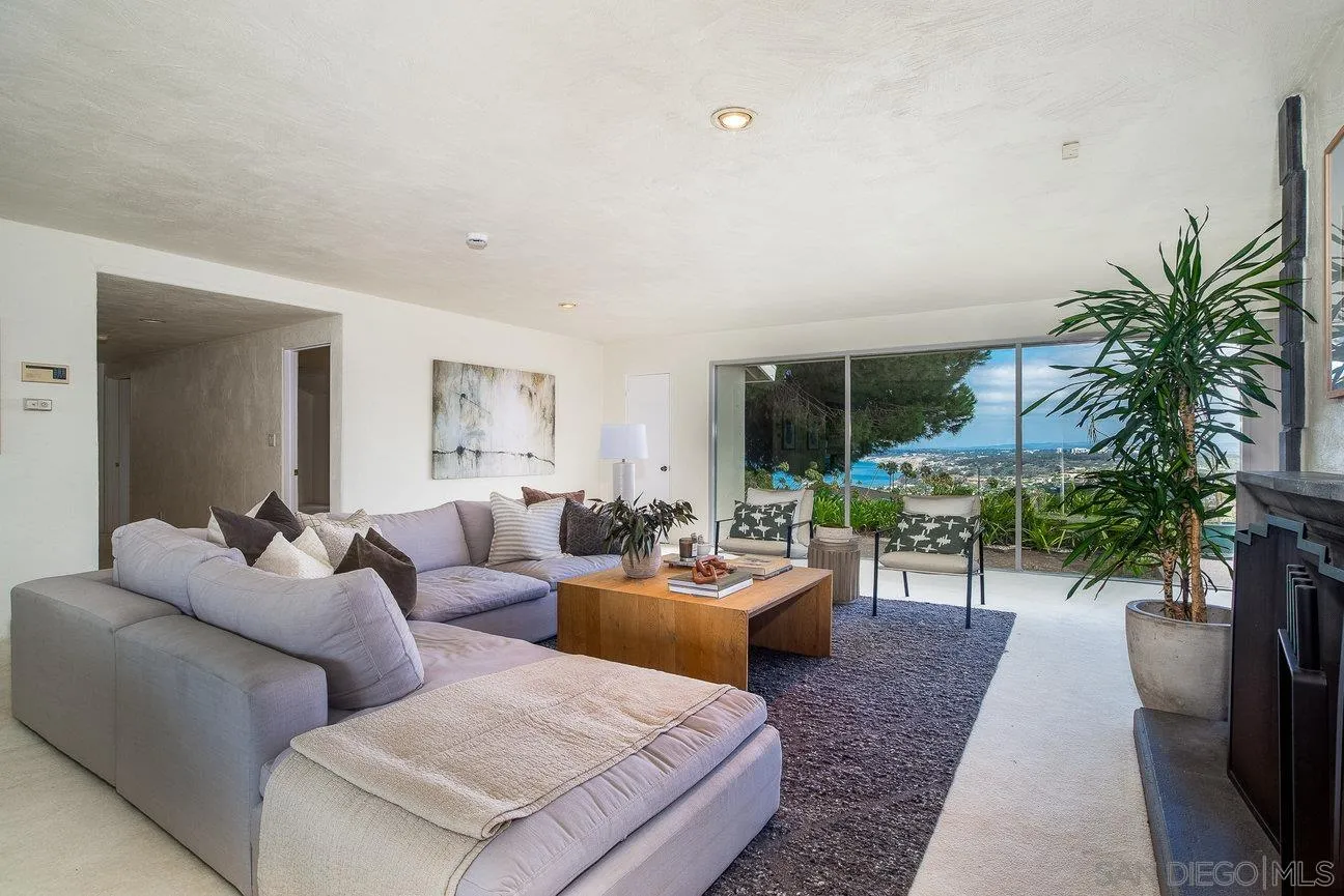 2349 Rue Adriane La Jolla, CA 92037 - Photo 6 of 36 a living room with furniture and a large window
