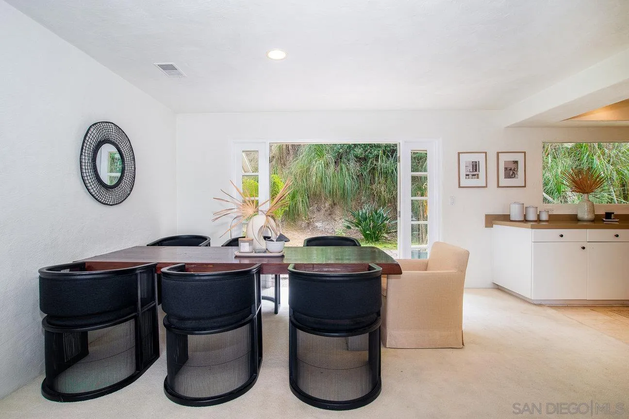 2349 Rue Adriane La Jolla, CA 92037 - Photo 9 of 36 a view of a workspace with furniture and a large window
