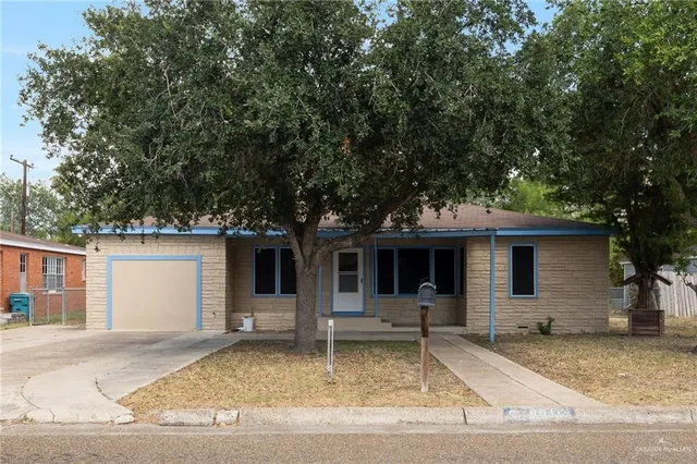 a house with trees in the background