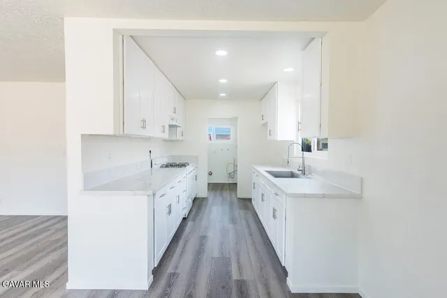 a view of a kitchen with electric appliances