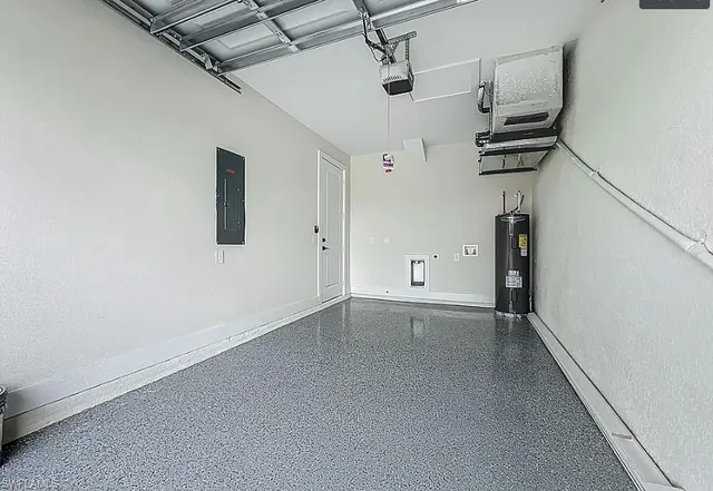 a view of a room with wooden floor and a window