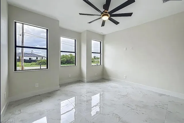 an empty room with windows and closet