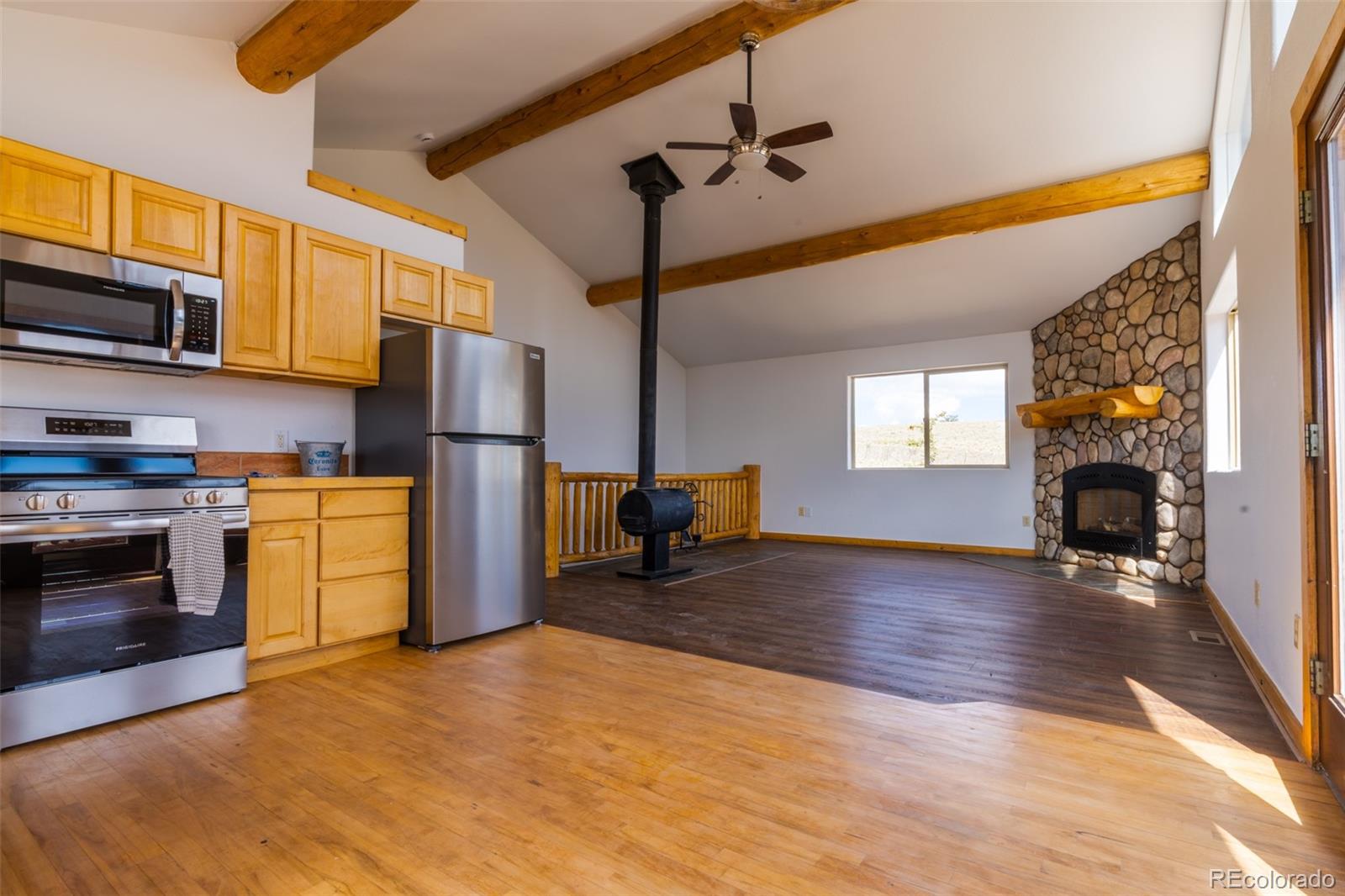 1155 Travois Road Jefferson, CO 80456 - Photo 12 of 31 a kitchen with a sink appliances and cabinets