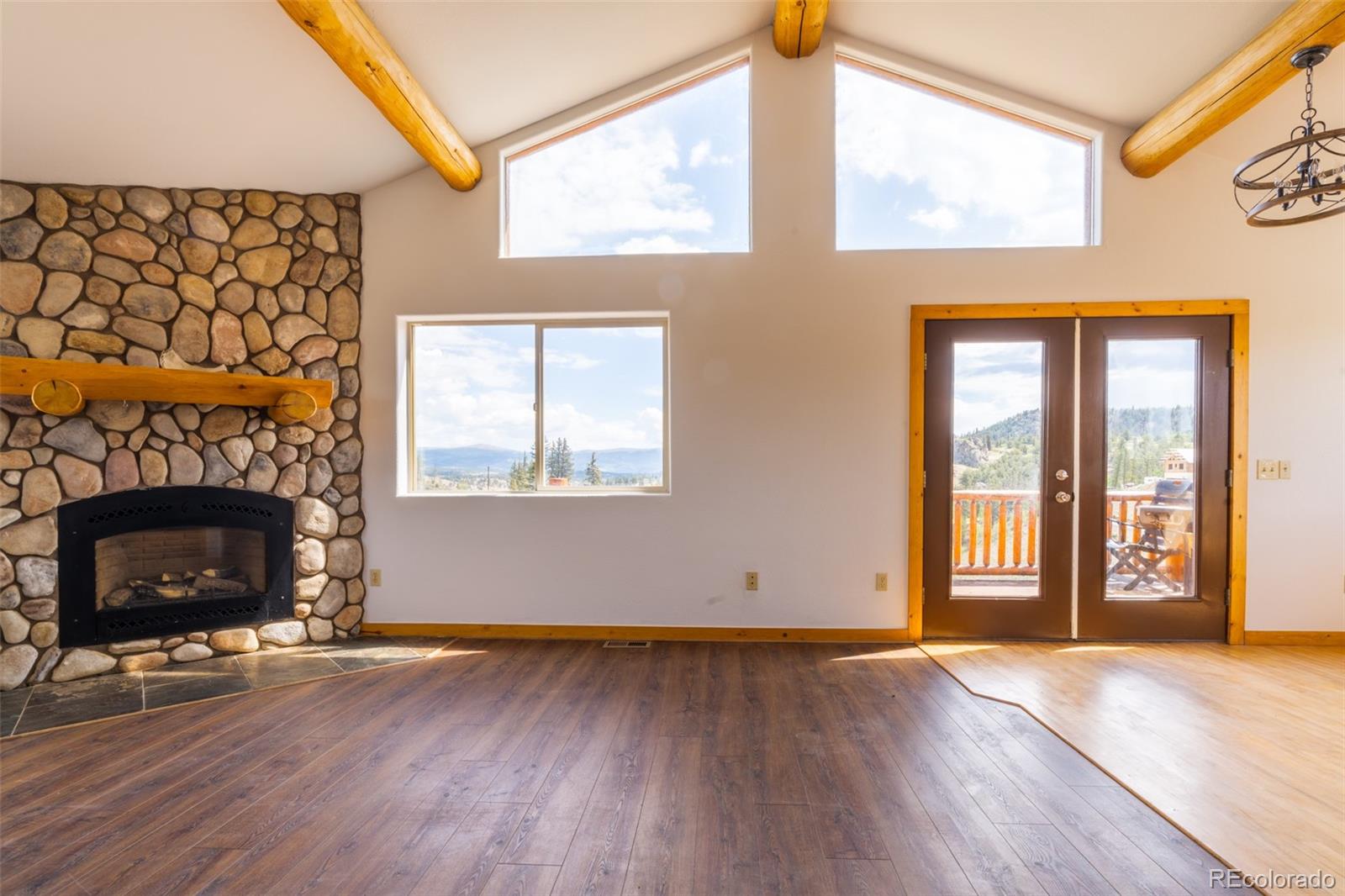 1155 Travois Road Jefferson, CO 80456 - Photo 13 of 31 a view of an empty room with wooden floor and a window