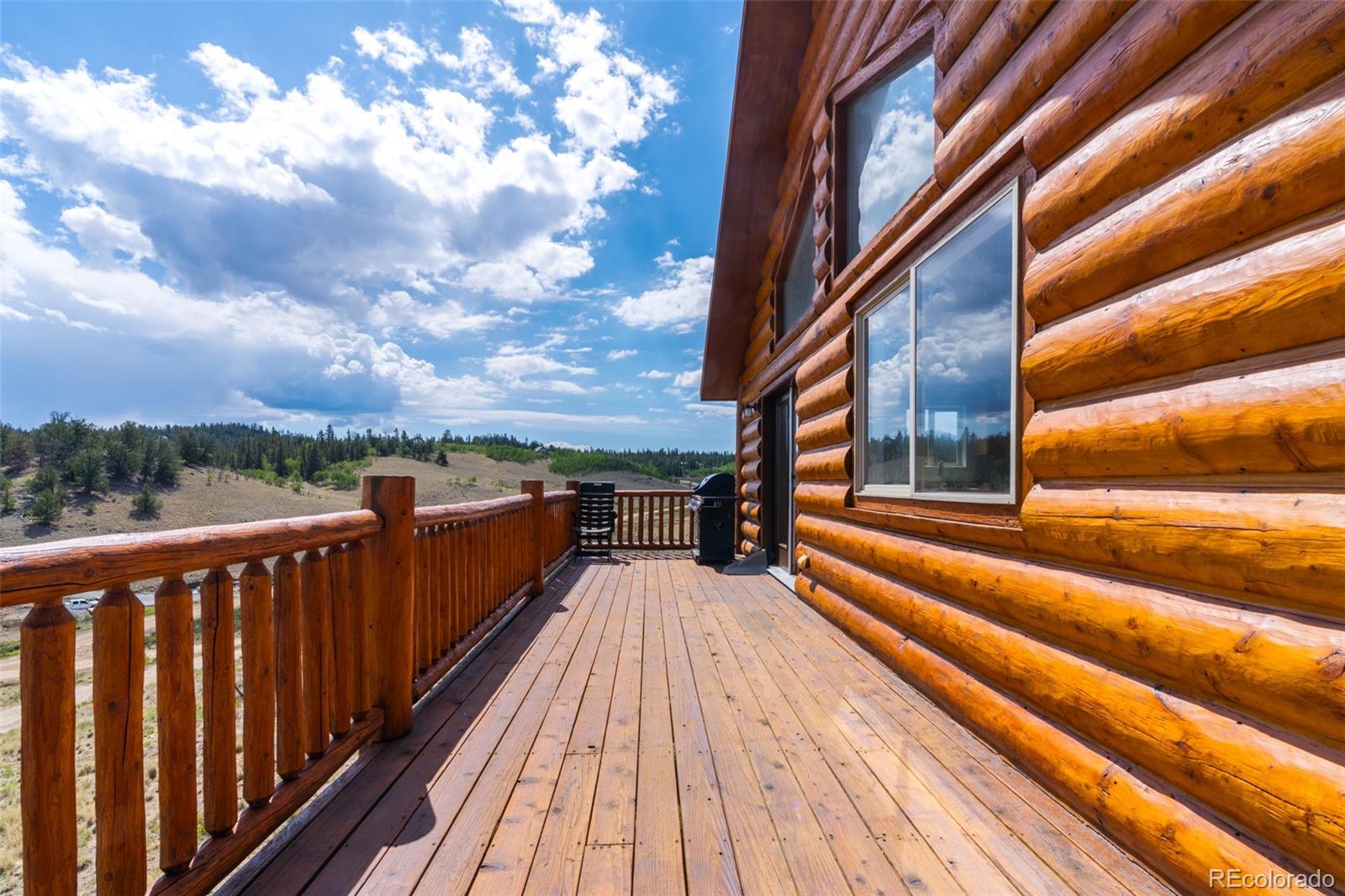 1155 Travois Road Jefferson, CO 80456 - Photo 19 of 31 a view of balcony with wooden floor and fence