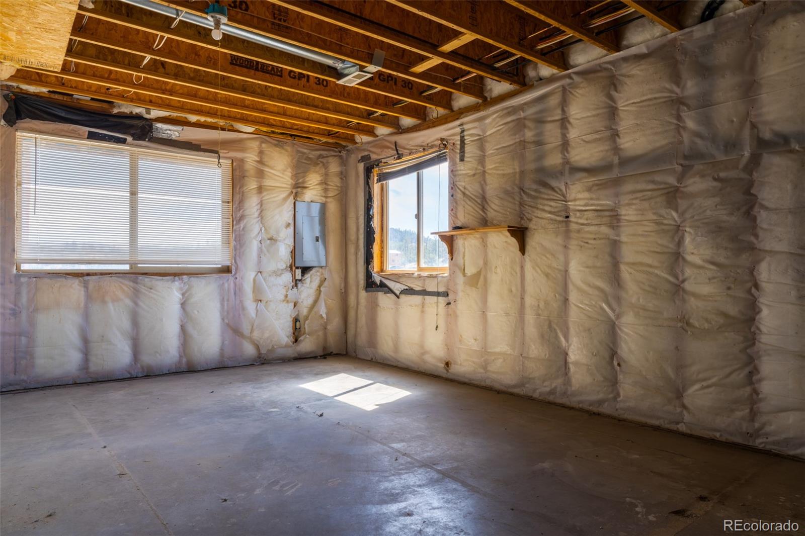 1155 Travois Road Jefferson, CO 80456 - Photo 23 of 31 a view of a room with wooden walls