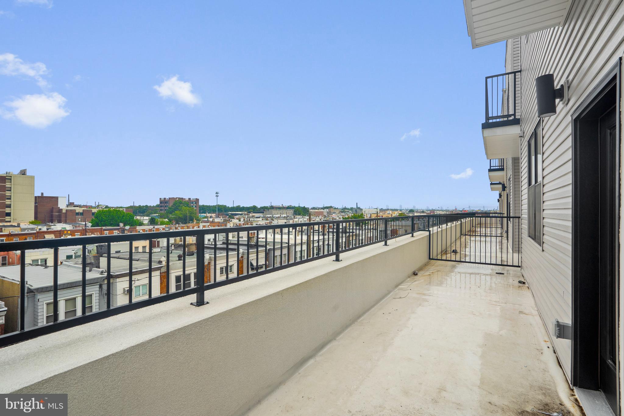 3211 Cedar Street, Unit 401 Philadelphia, PA 19134 - Photo 12 of 18 a view of balcony with city view