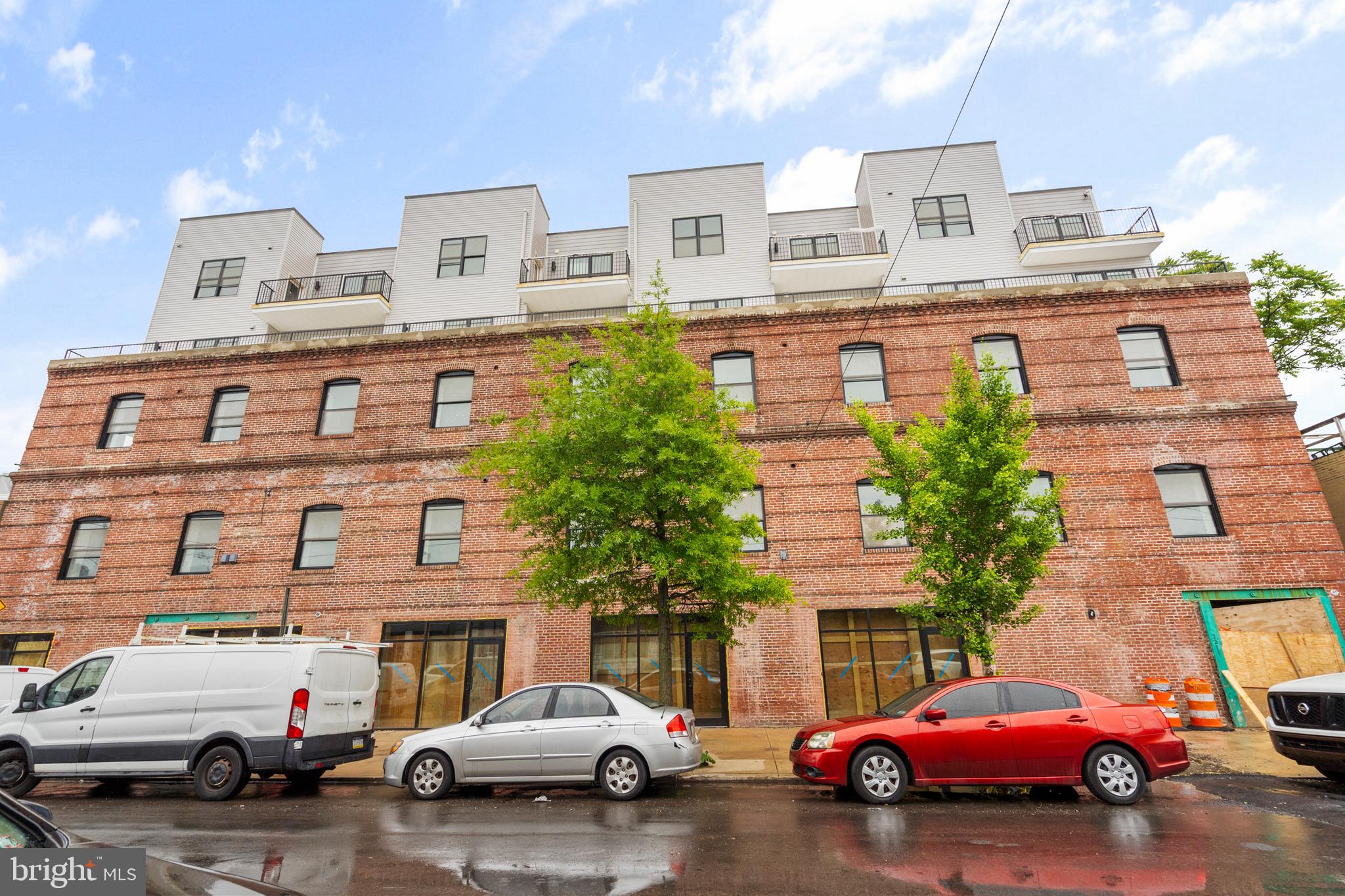 3211 Cedar Street, Unit 401 Philadelphia, PA 19134 - Photo 18 of 18 a car parked in front of a building