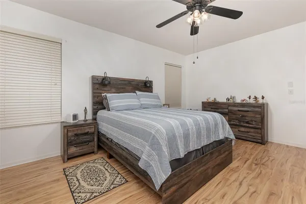 a bedroom with a bed and dresser