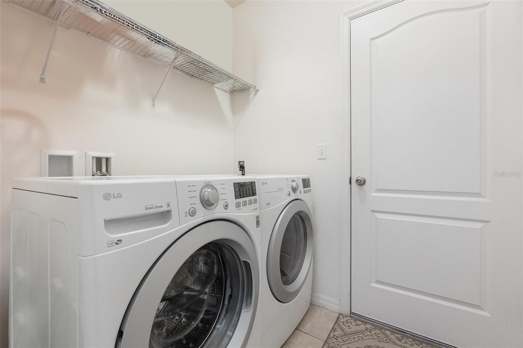 1569 Tamarind Road Davenport, FL 33896 - Photo 23 of 27 a view of washer and dryer in a utility room