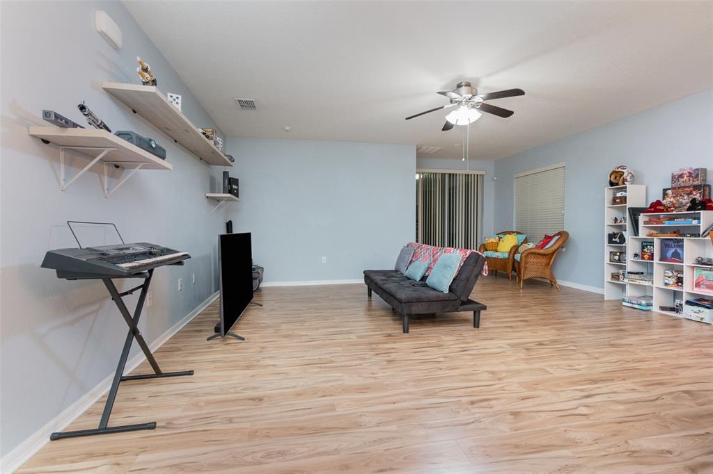 1569 Tamarind Road Davenport, FL 33896 - Photo 8 of 27 a living room with furniture