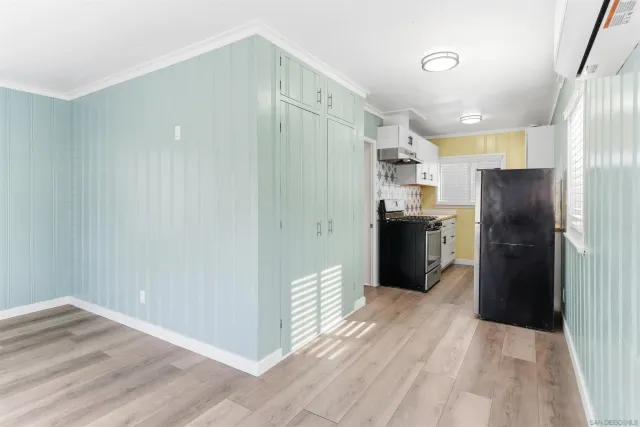 a kitchen with stainless steel appliances a refrigerator and a sink