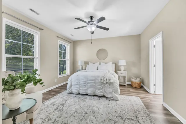 a bedroom with a bed and window