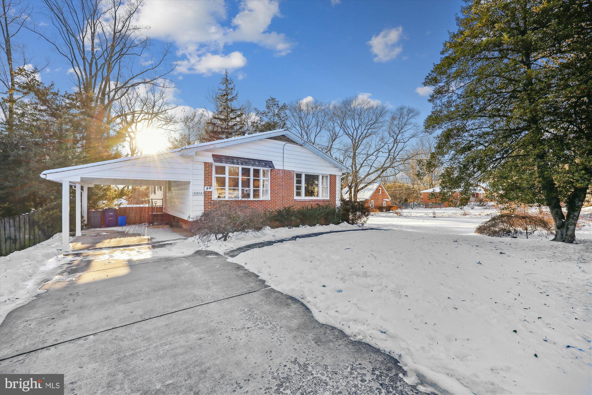 11310 Mapleview Drive Silver Spring, MD 20902 - Photo 1 of 40 a view of a house with snow on the road