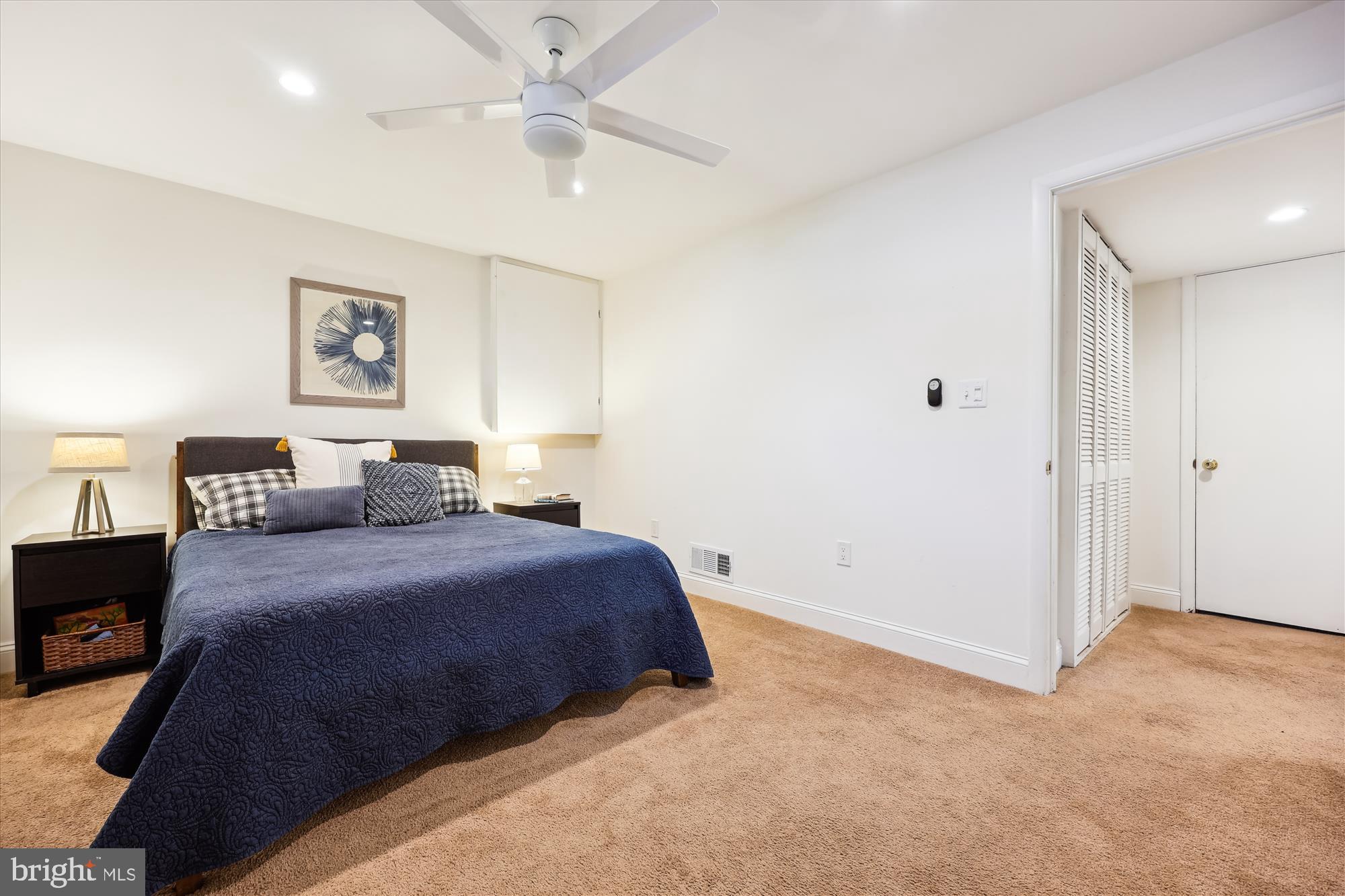 11310 Mapleview Drive Silver Spring, MD 20902 - Photo 20 of 40 a bedroom with a bed and a tv