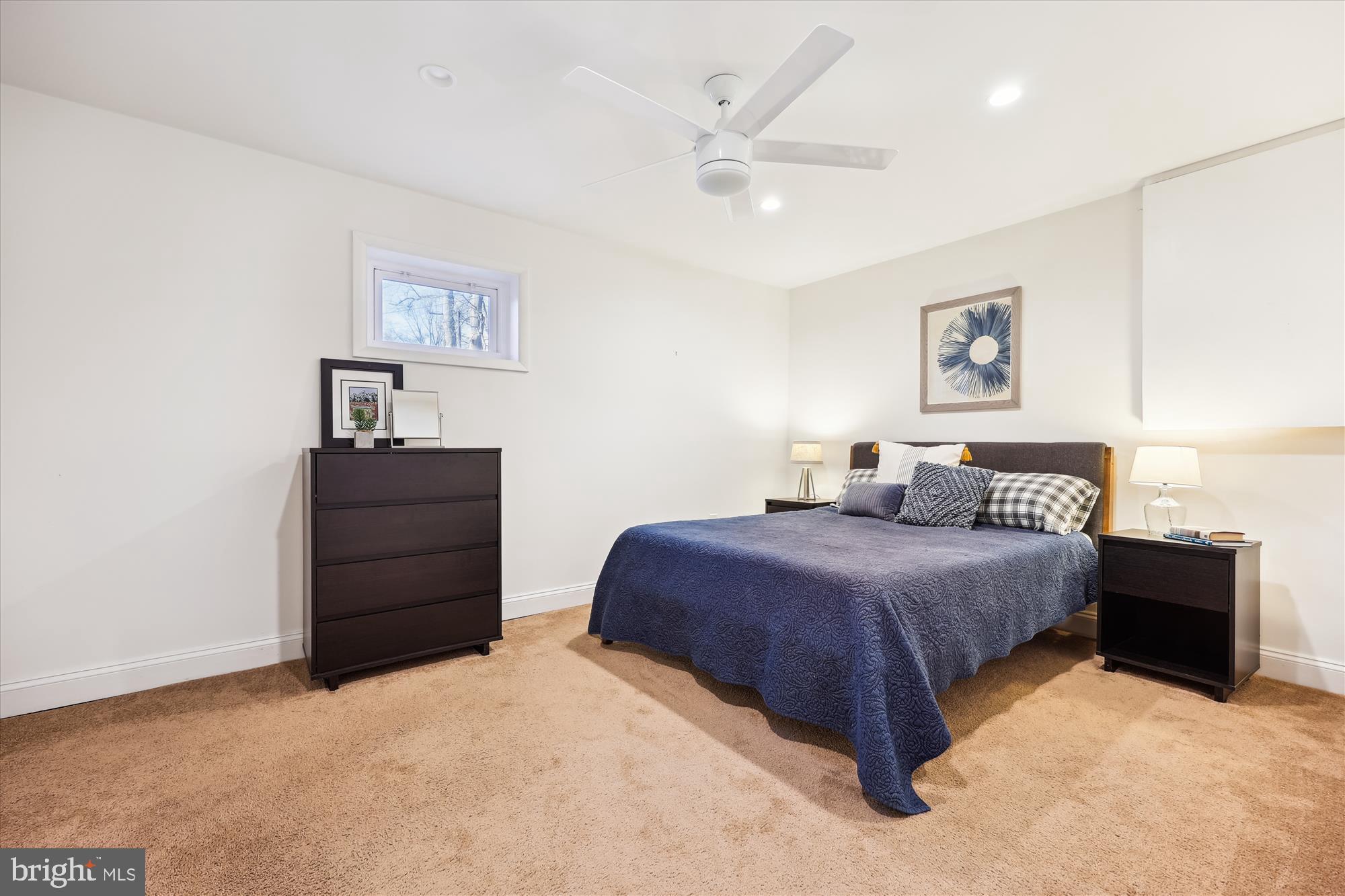 11310 Mapleview Drive Silver Spring, MD 20902 - Photo 21 of 40 a bedroom with a bed and a painting on the wall