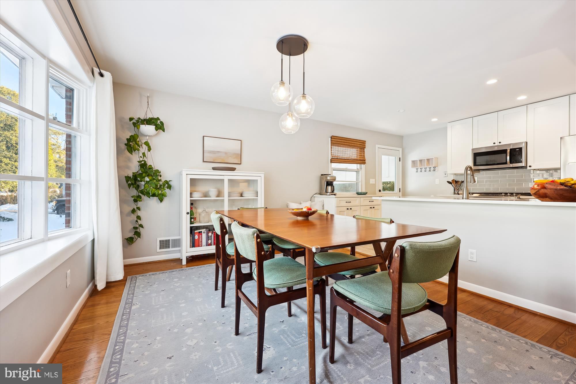 11310 Mapleview Drive Silver Spring, MD 20902 - Photo 6 of 40 a view of a dining room with furniture and a chandelier