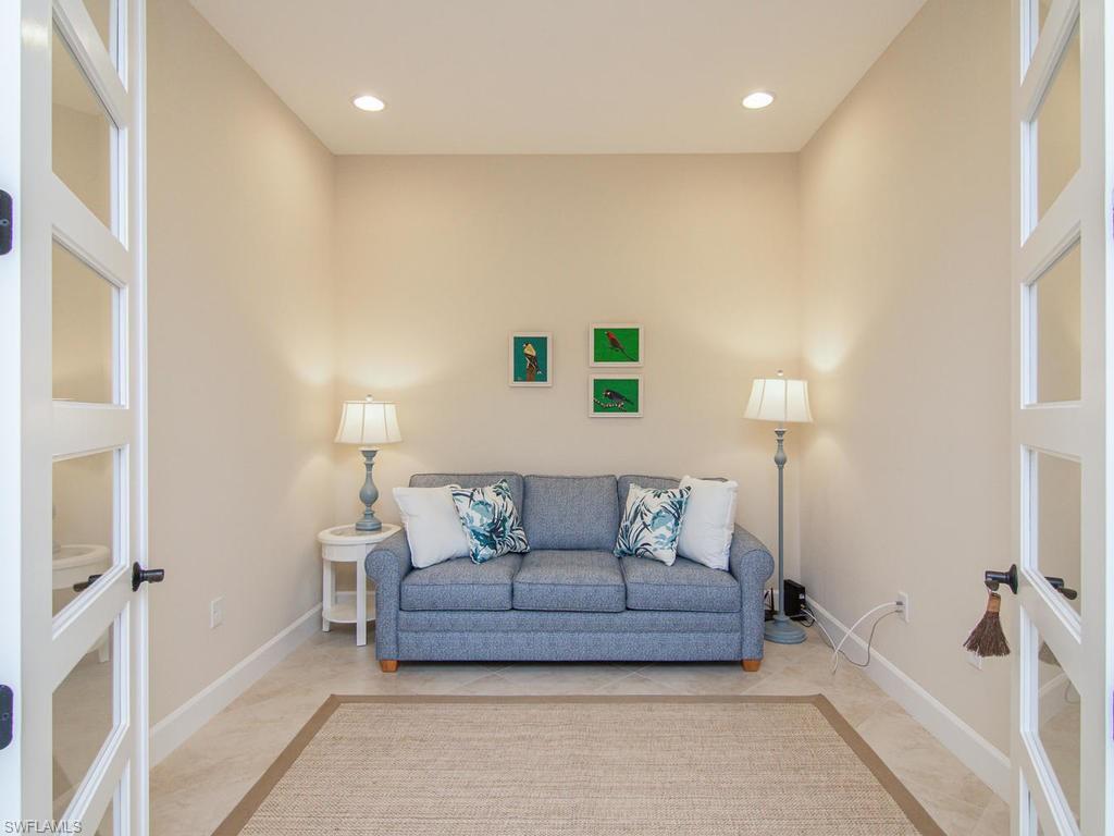 7002 Dominica Drive Naples, FL 34113 - Photo 13 of 33 a living room with furniture and a rug
