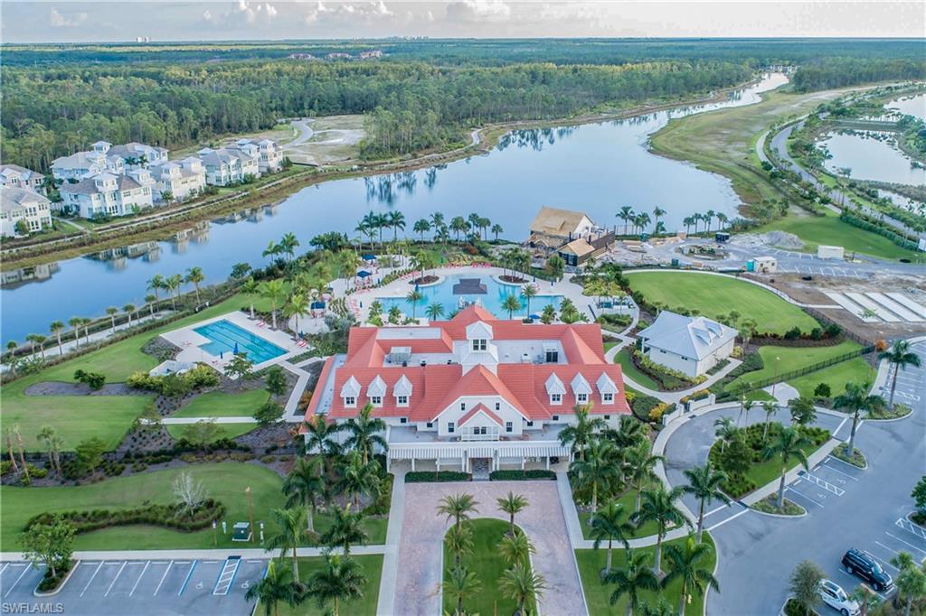 7002 Dominica Drive Naples, FL 34113 - Photo 30 of 33 an aerial view of lake residential house with swimming pool and outdoor space