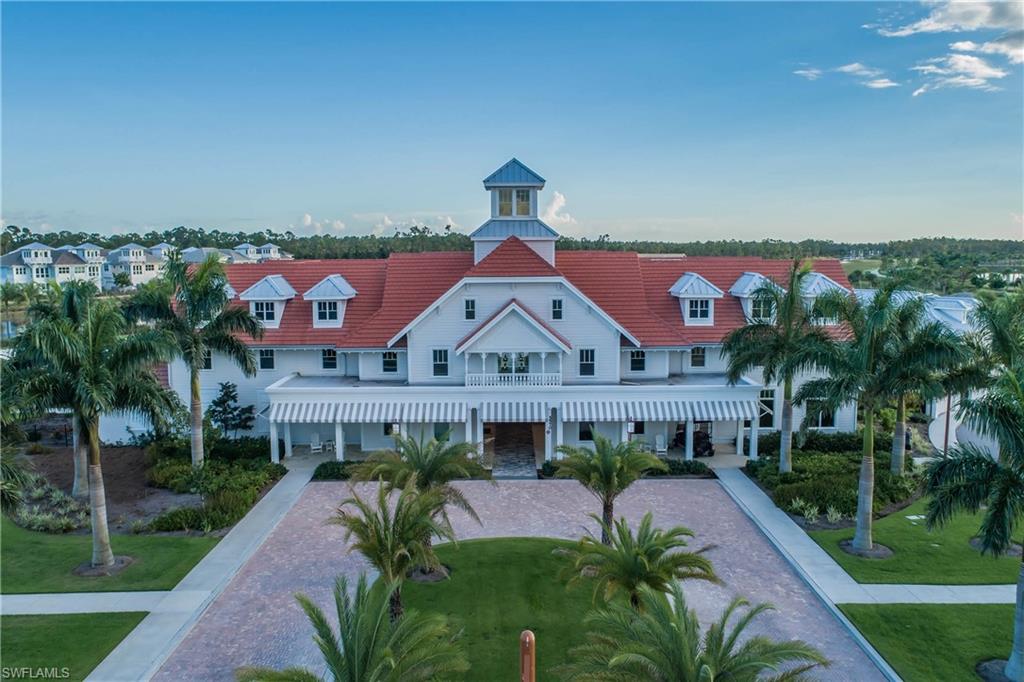 7002 Dominica Drive Naples, FL 34113 - Photo 31 of 33 a front view of a house with a yard