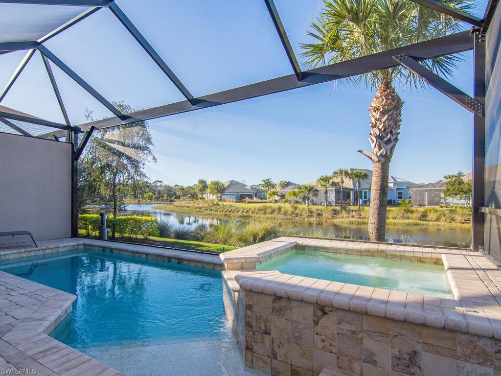 7002 Dominica Drive Naples, FL 34113 - Photo 7 of 33 a view of a swimming pool with a outdoor seating