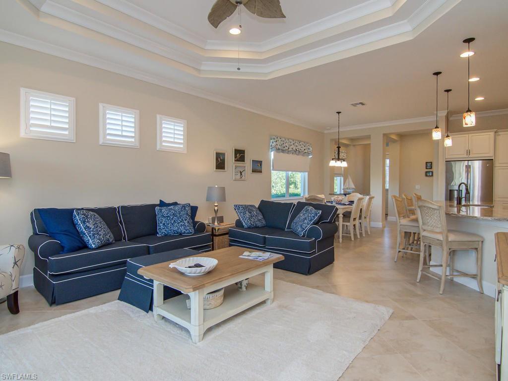 7002 Dominica Drive Naples, FL 34113 - Photo 9 of 33 a living room with furniture and a large window