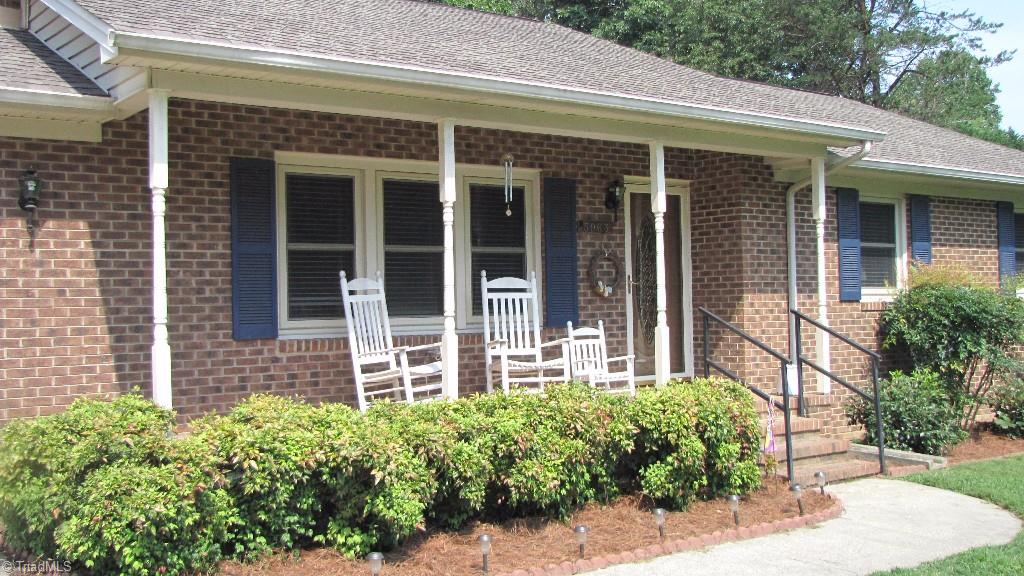 3963 Lewiston Road Summerfield, NC 27358 - Photo 2 of 22 Rocking chair front porch