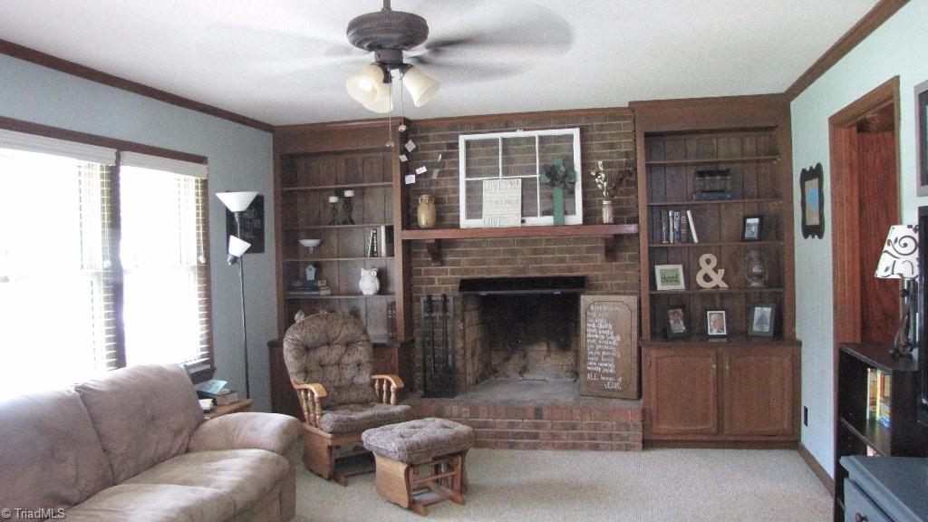 3963 Lewiston Road Summerfield, NC 27358 - Photo 4 of 22 Living room with fireplace