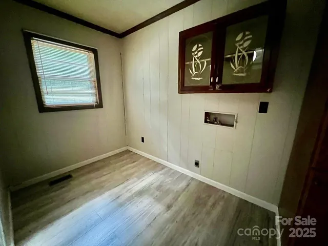 a view of an entryway with wooden floor