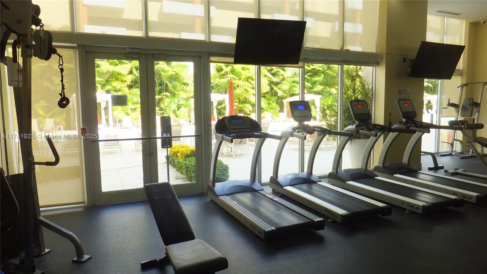 2775 Northeast 187th Street, Unit 329 Aventura, FL 33180 - Photo 21 of 21 a view of a room with gym equipment