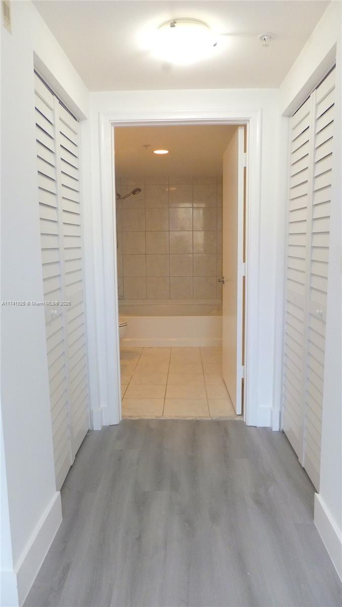 2775 Northeast 187th Street, Unit 329 Aventura, FL 33180 - Photo 8 of 21 an empty room with a natural light