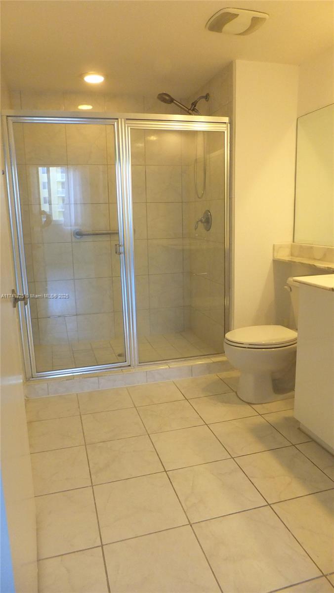 2775 Northeast 187th Street, Unit 329 Aventura, FL 33180 - Photo 10 of 21 a bathroom with a shower and a toilet