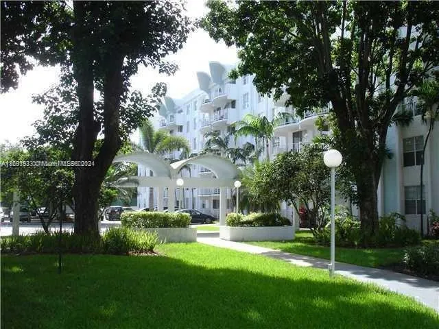 a view of a building with a yard