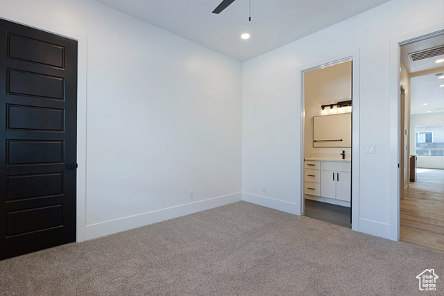 3145 Snow Cyn Road Hurricane, UT 84737 - Photo 24 of 38 Unfurnished bedroom featuring carpet, connected bathroom, and recessed lighting