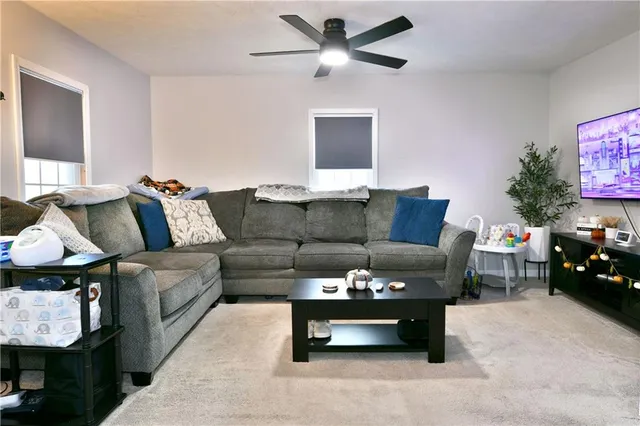 a living room with furniture and a couch