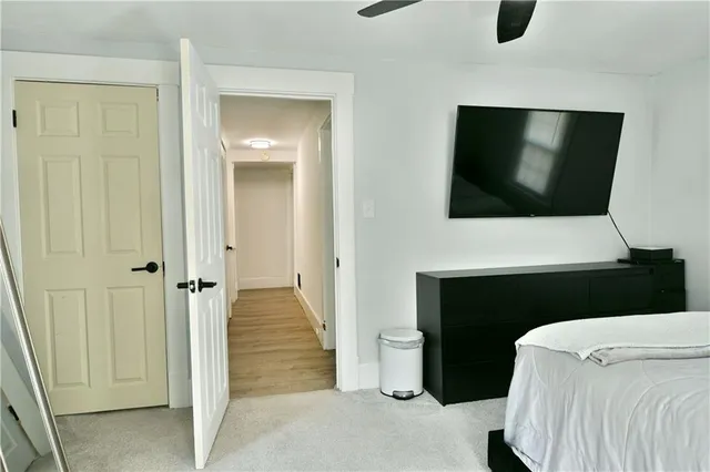 a view of a livingroom with furniture and a flat screen tv